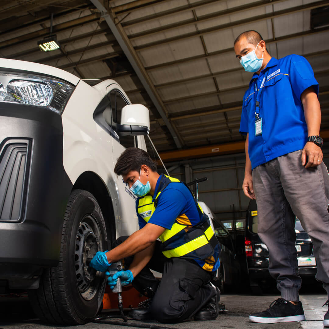 Man fixing a car tire